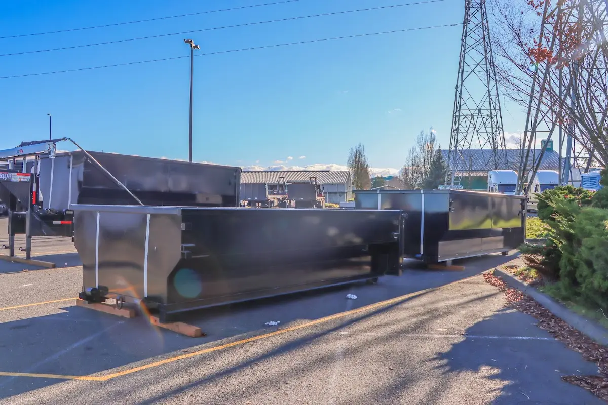 Roll-off dumpster ready for waste disposal at job site for Yard Waste Dumpster Rental in Ashland
